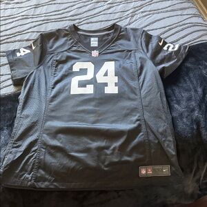 NFL Nike woman’s Black and White raider Jersey